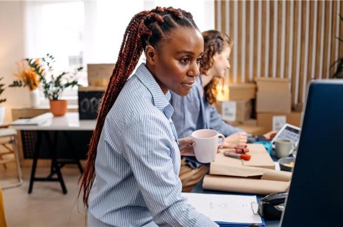 Woman typing on the computer